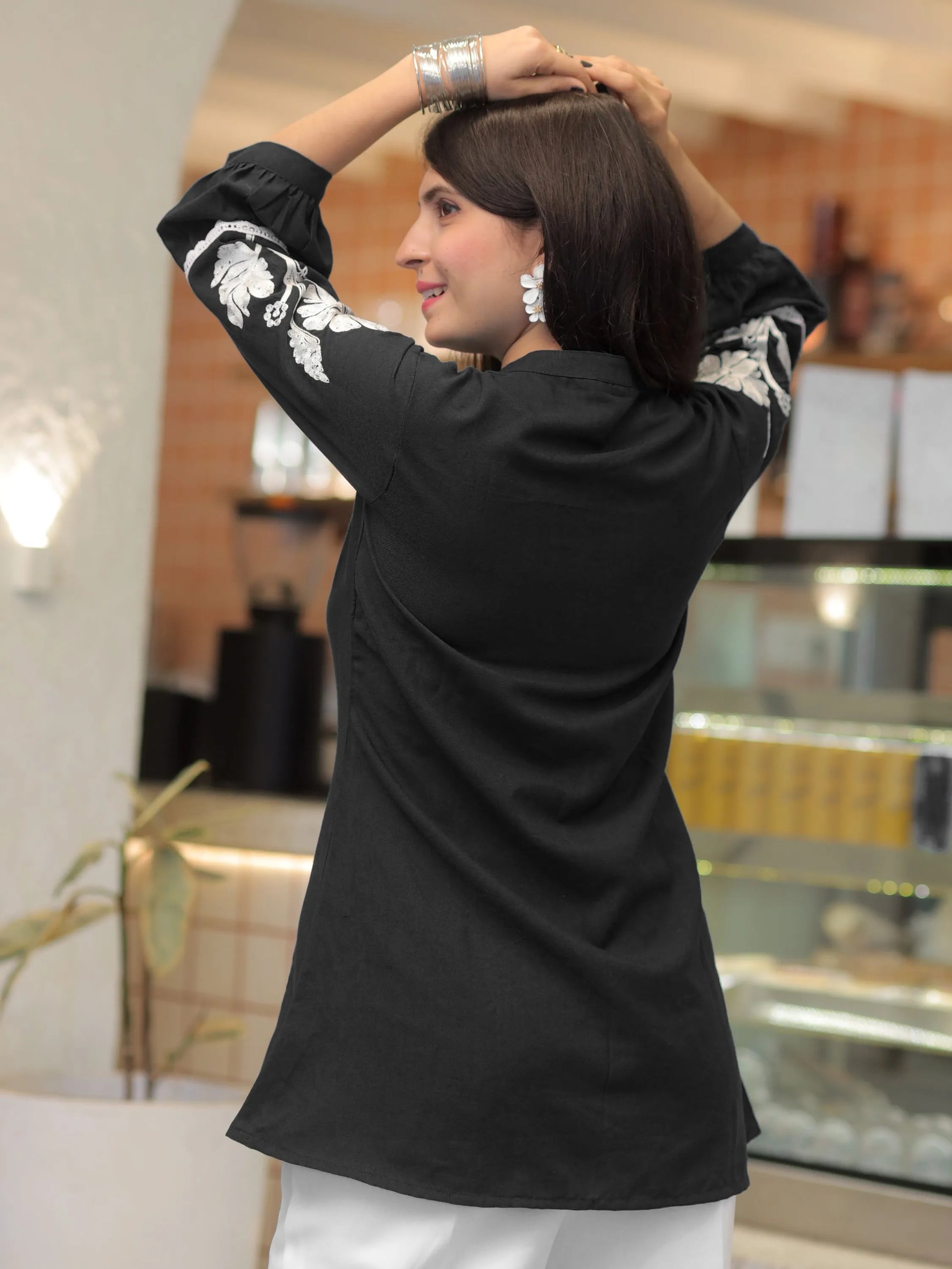 Black rayon peplum top — side view | Youthnic