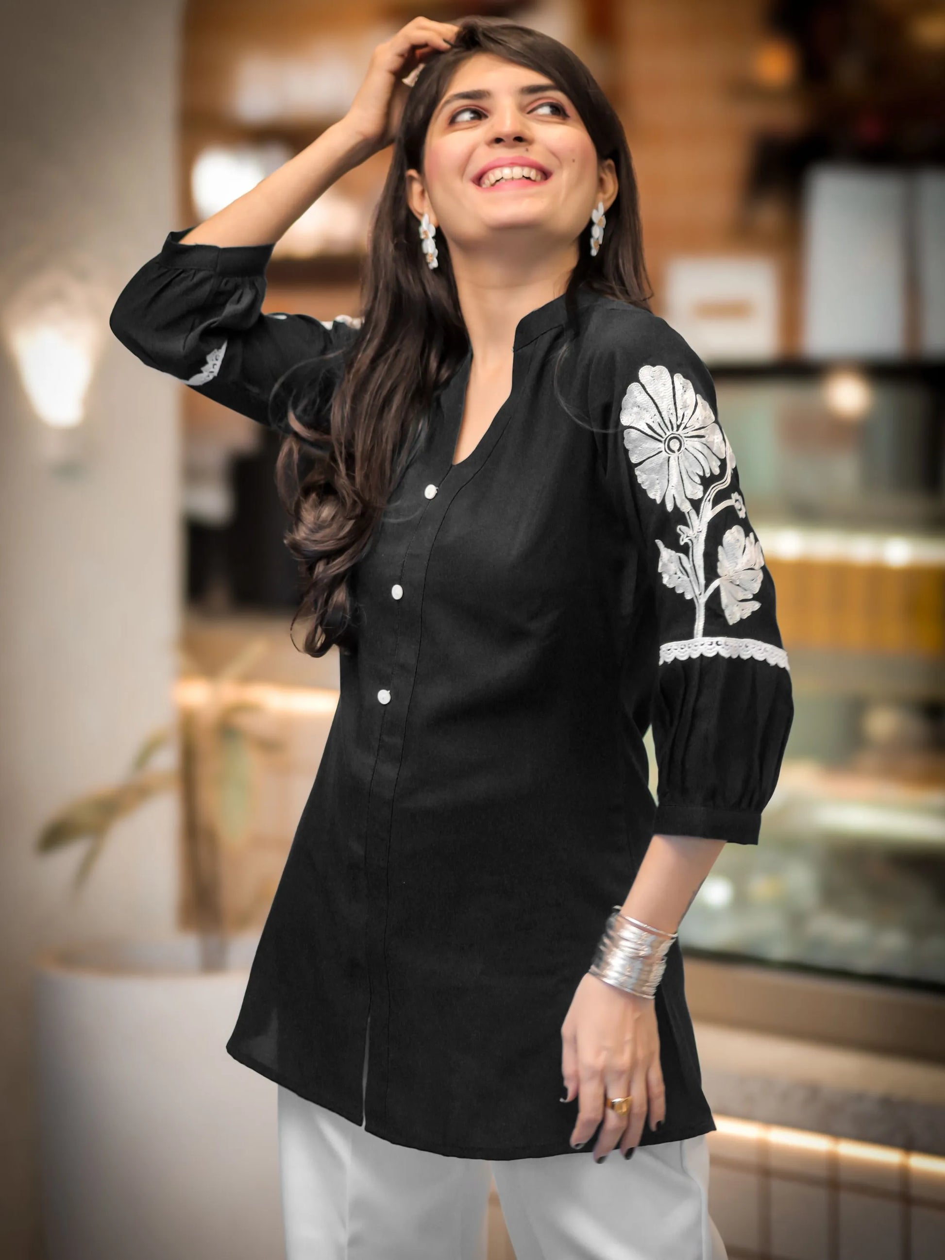 Black rayon peplum top — sleeve embroidery close-up | Youthnic