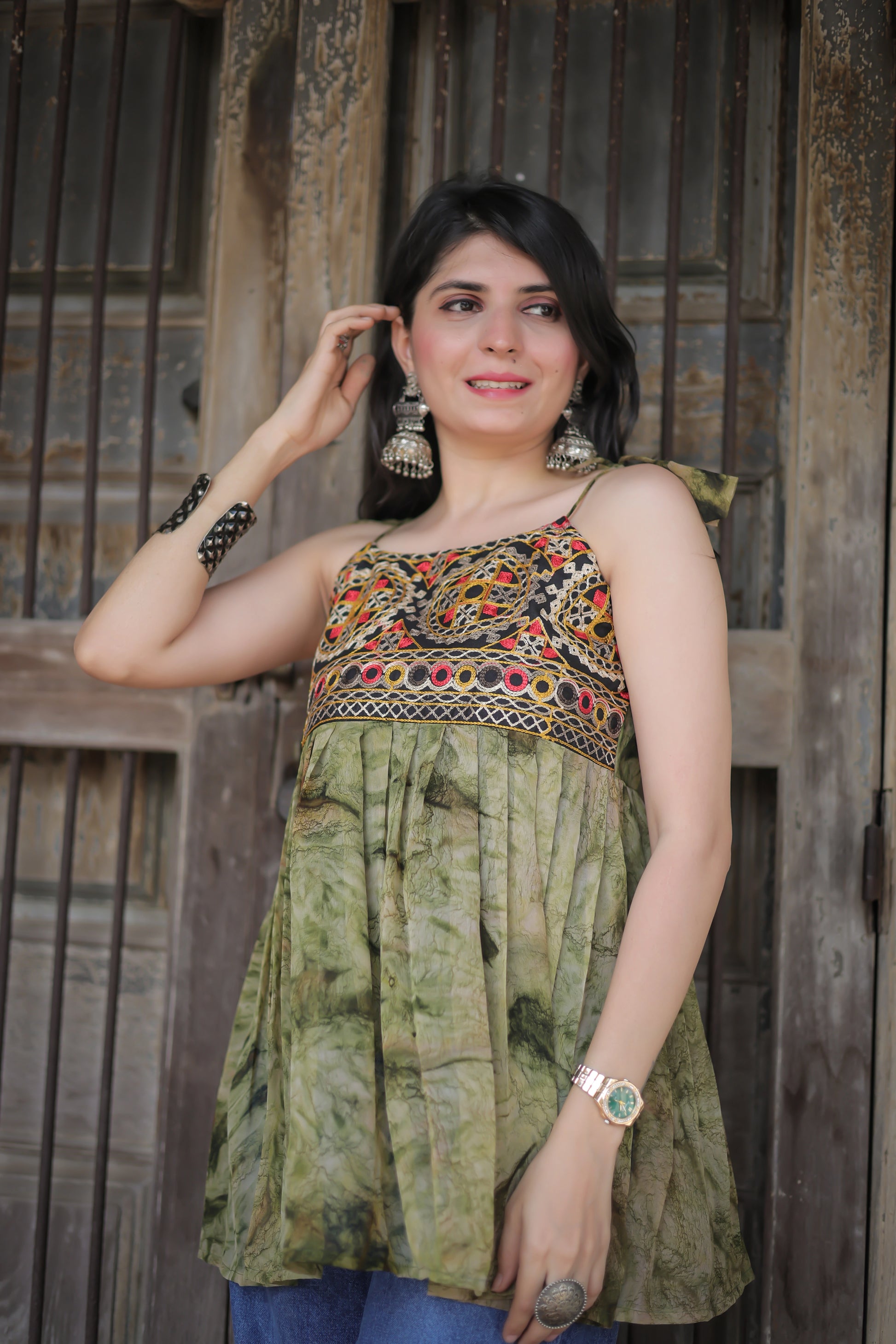 Green georgette embroidered shoulder knot kurti — styled with palazzos | Youthnic