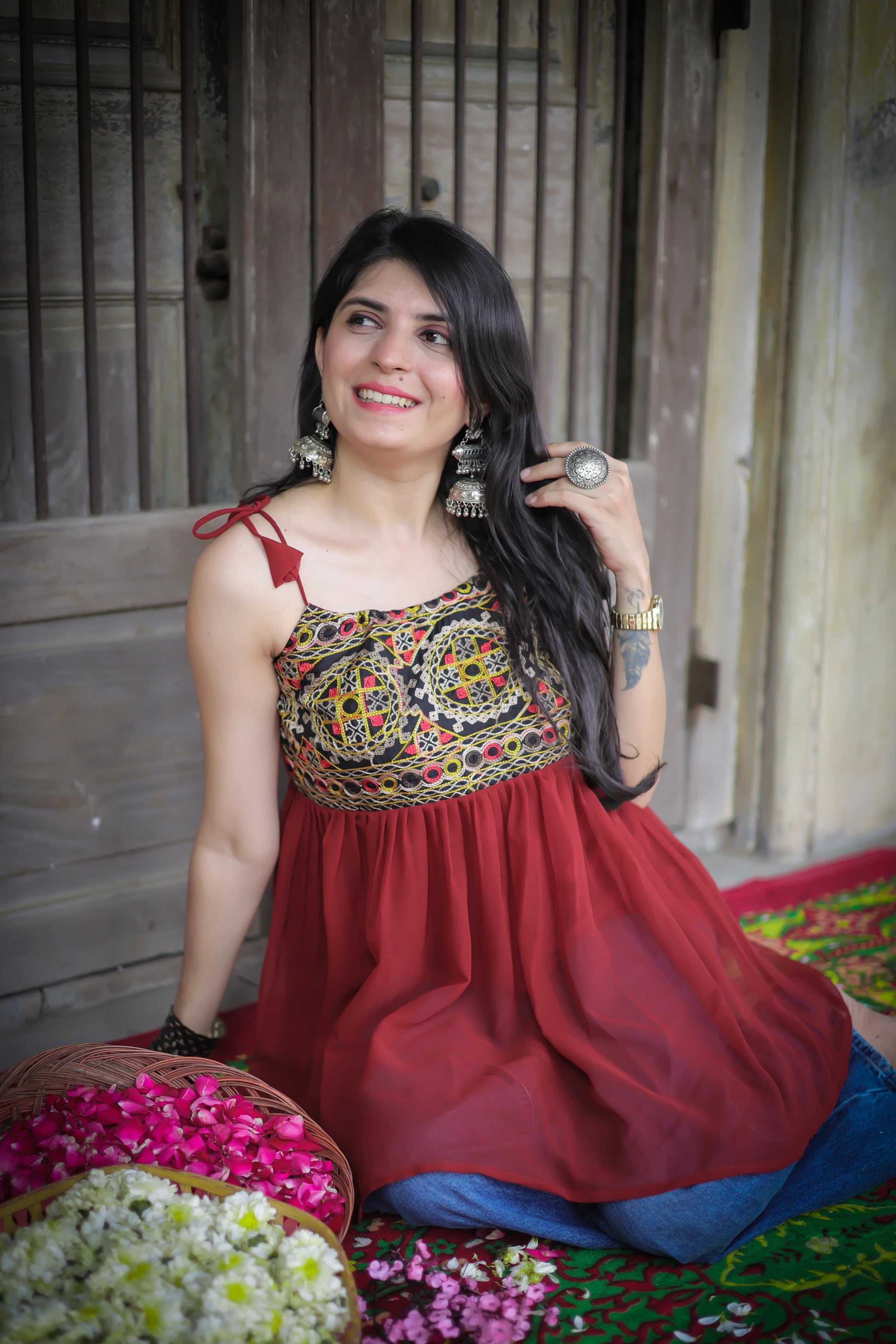 Rust georgette embroidered shoulder knot flared short kurti — styled with palazzos | Youthnic