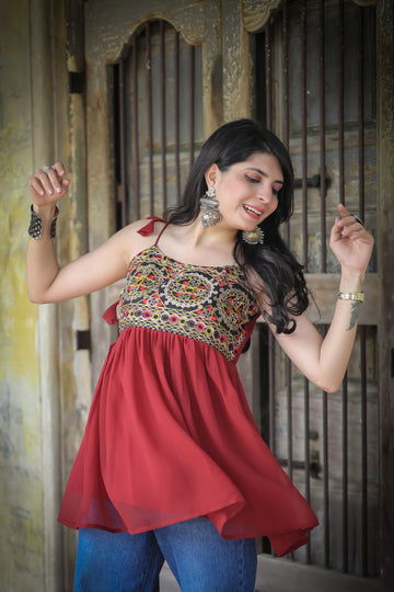 Rust georgette embroidered shoulder knot flared short kurti — front view | Youthnic